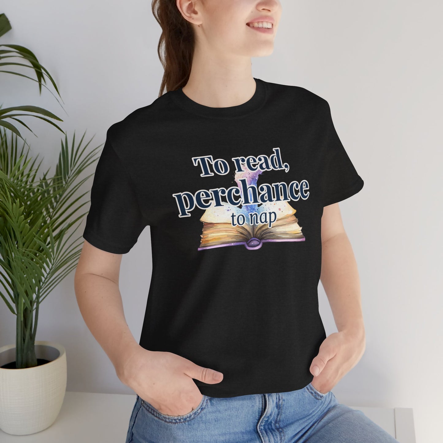 "To Read, Perchance to Nap" on an open book full of magic on a lightweight unisex tee