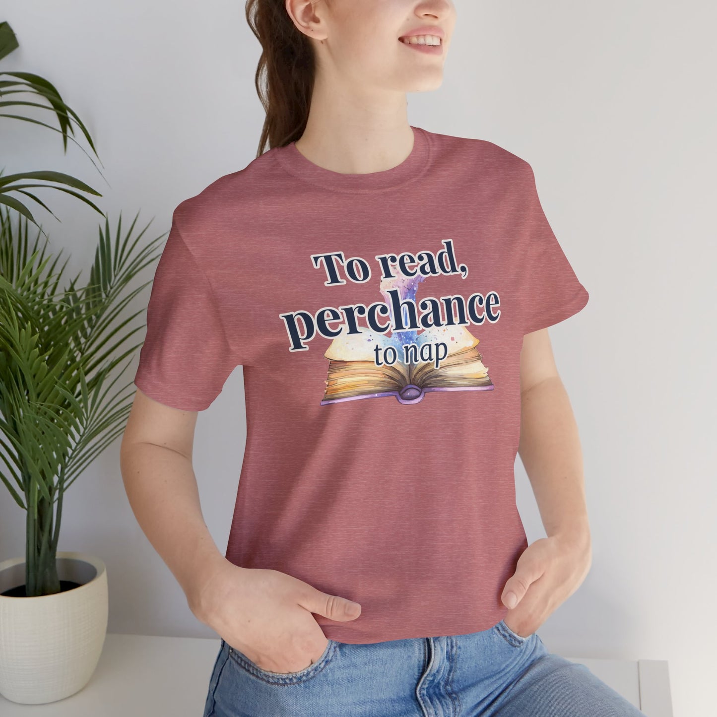 "To Read, Perchance to Nap" on an open book full of magic on a lightweight unisex tee
