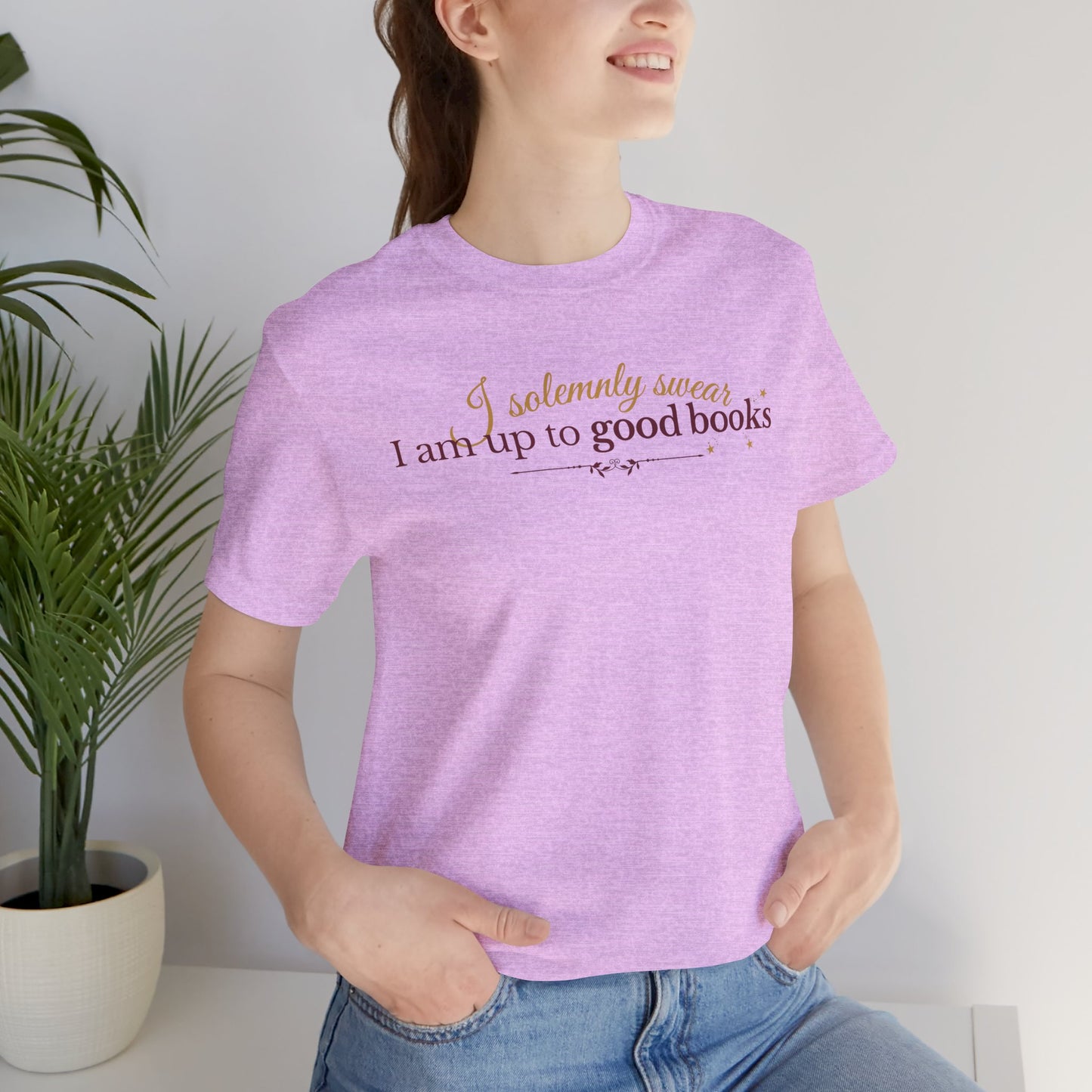 "I solemnly swear I am up to good books"; in a clean and enchanting design on a lightweight unisex tee