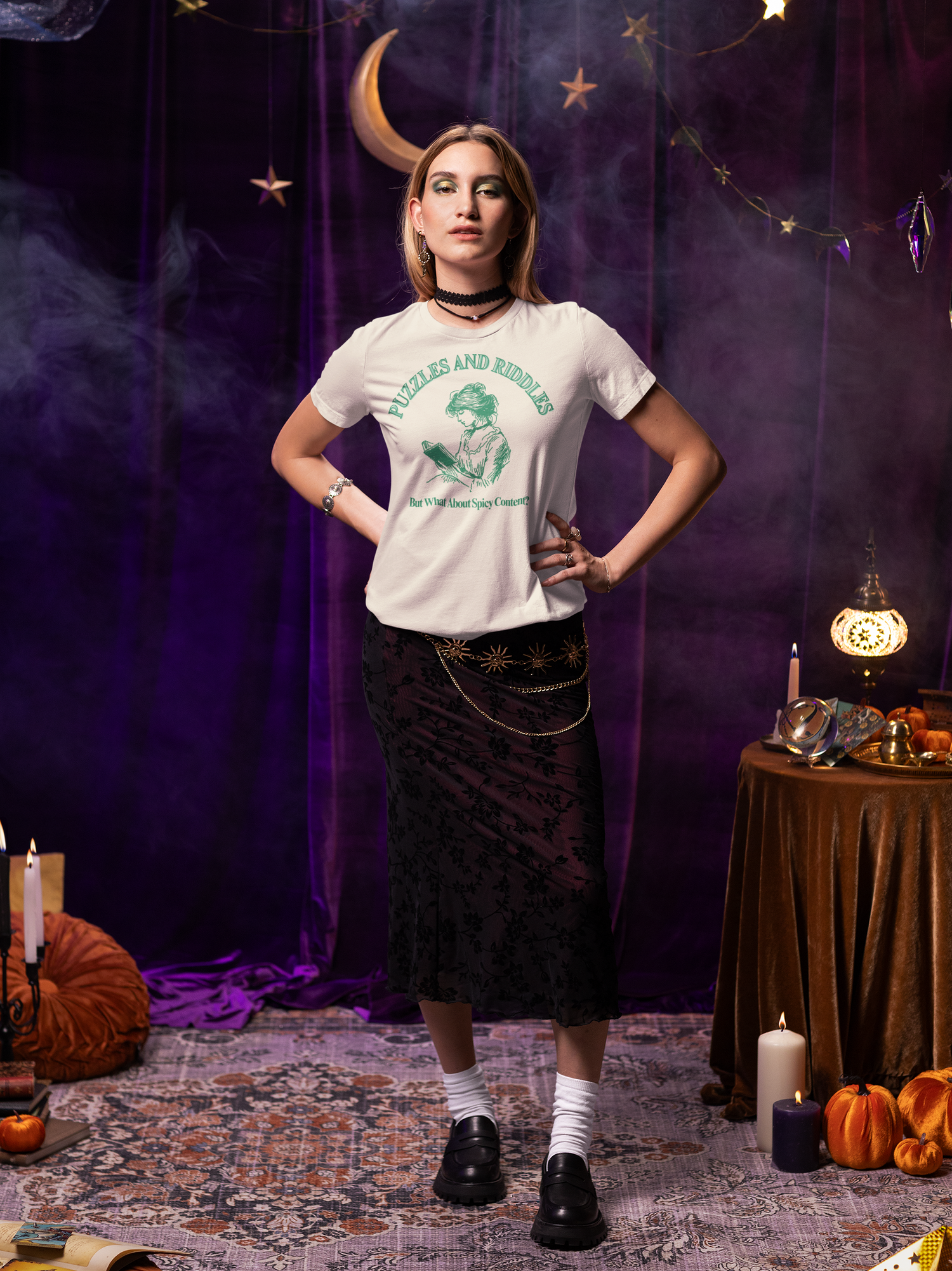 Girl wearing a t-shirt stating "Puzzles and Riddles - But What About Spicy Content? The background are various arcane looking equipment. 